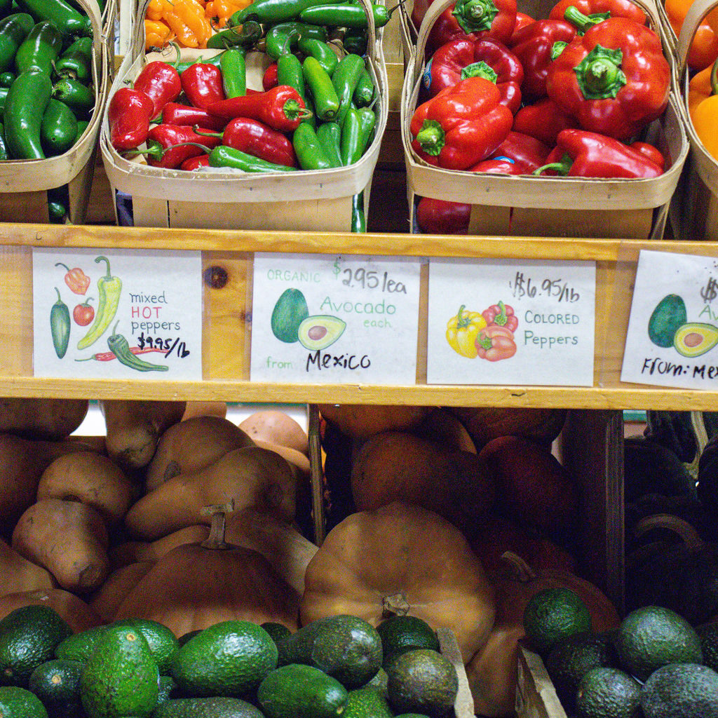 Farm stand produce display with fresh peppers, avocados, and squash supporting farm fresh meals at Morning Glory Farm